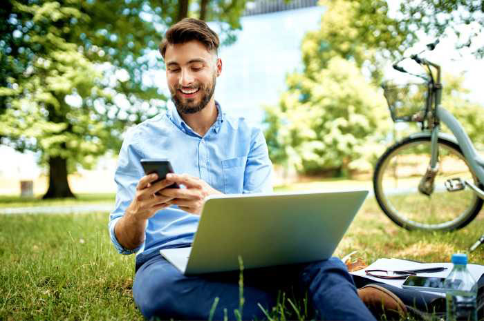 English teacher using an AI essay grader happily outside